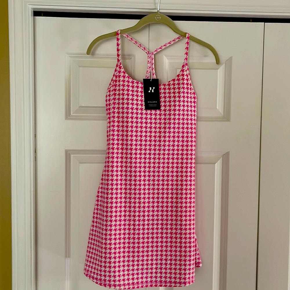 Halara tennis dress. One piece with shorts. Runs a bit long,approx 30.5”.